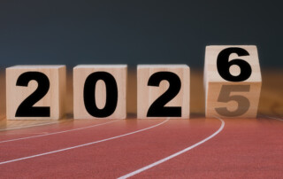 Multi exposure of running track and wooden cube 2025 2026 new year in concept of action business plan targets the new year 2026 growth