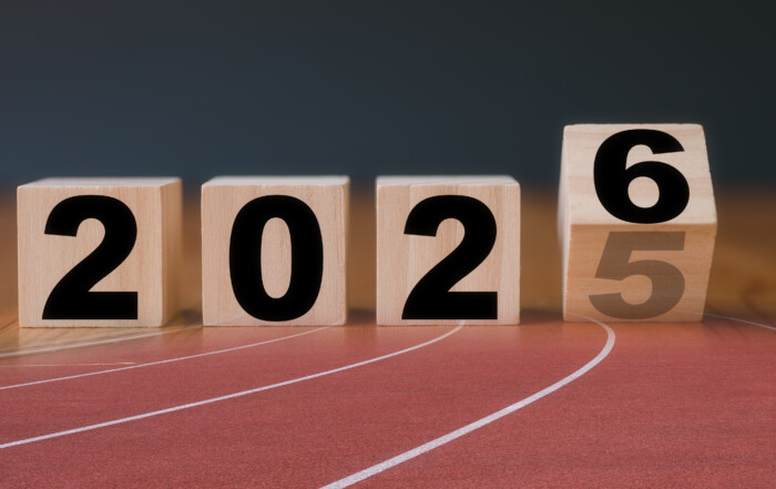 Multi exposure of running track and wooden cube 2025 2026 new year in concept of action business plan targets the new year 2026 growth